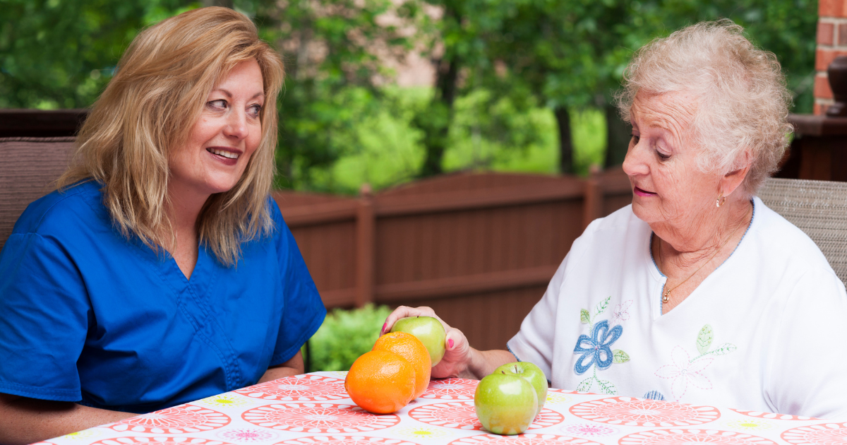 Caring for a Loved One With Aphasia Elderly sitting with caregiver