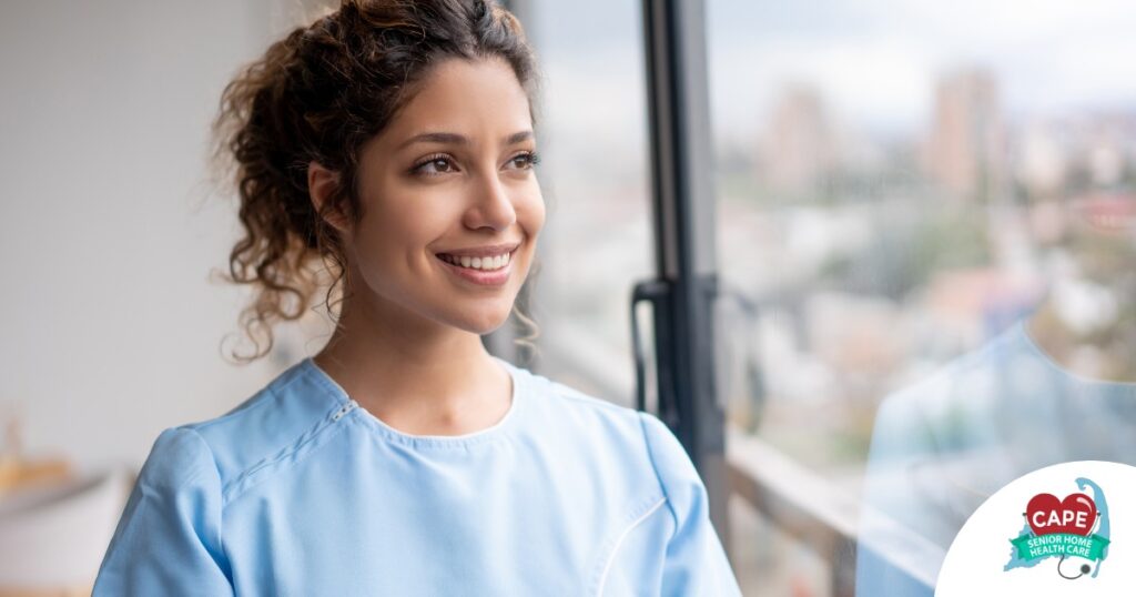 A woman smiles while looking ahead hopefully, showing the positive outlook that planning for a home care career can bring.