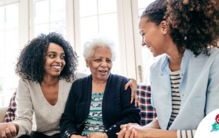 Caregiver talking to a family about Elderly Care