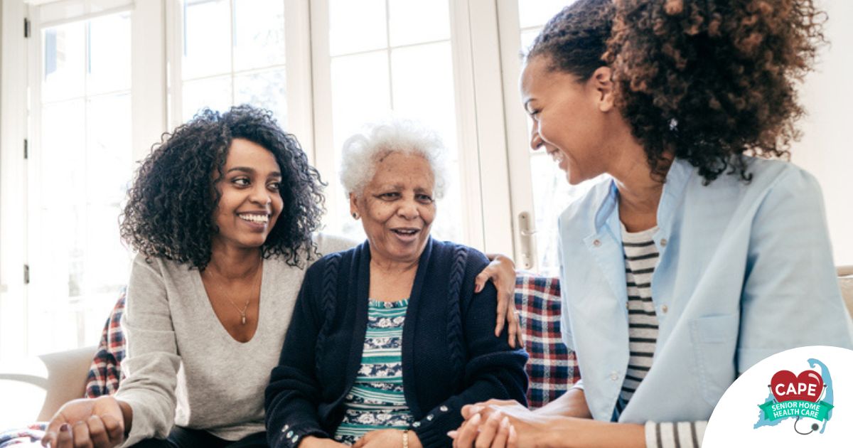 Caregiver talking to a family about Elderly Care