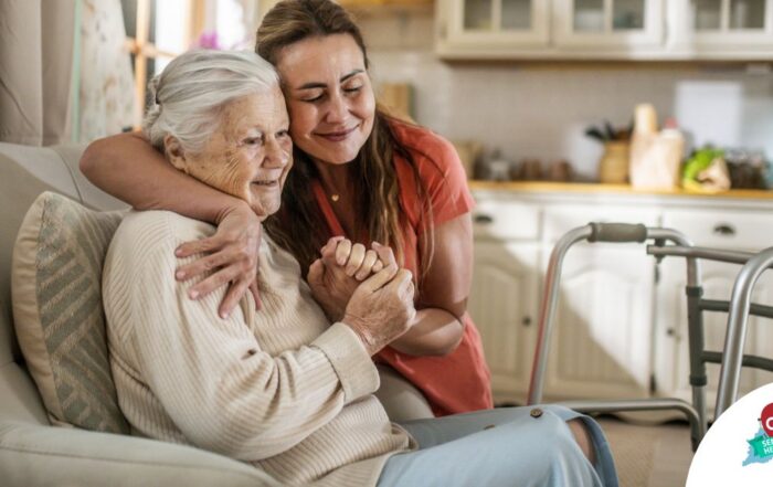 Caregiver supporting an elderly woman in the transition to senior home care