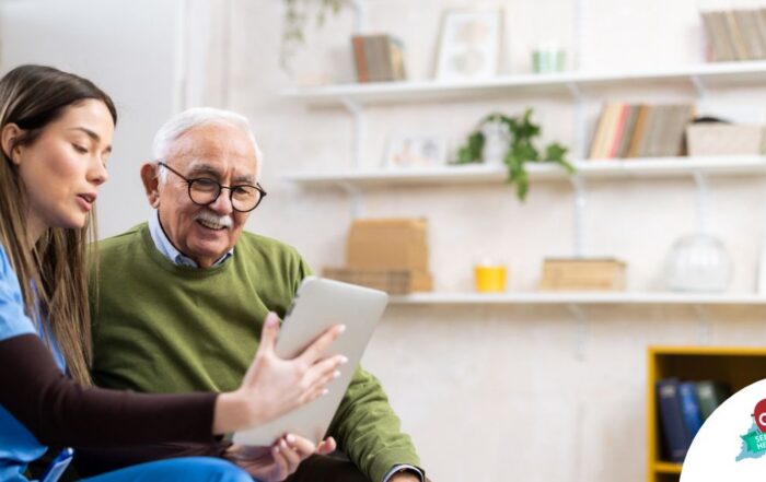 Home caregiver assisting senior man to use telehealth and senior care