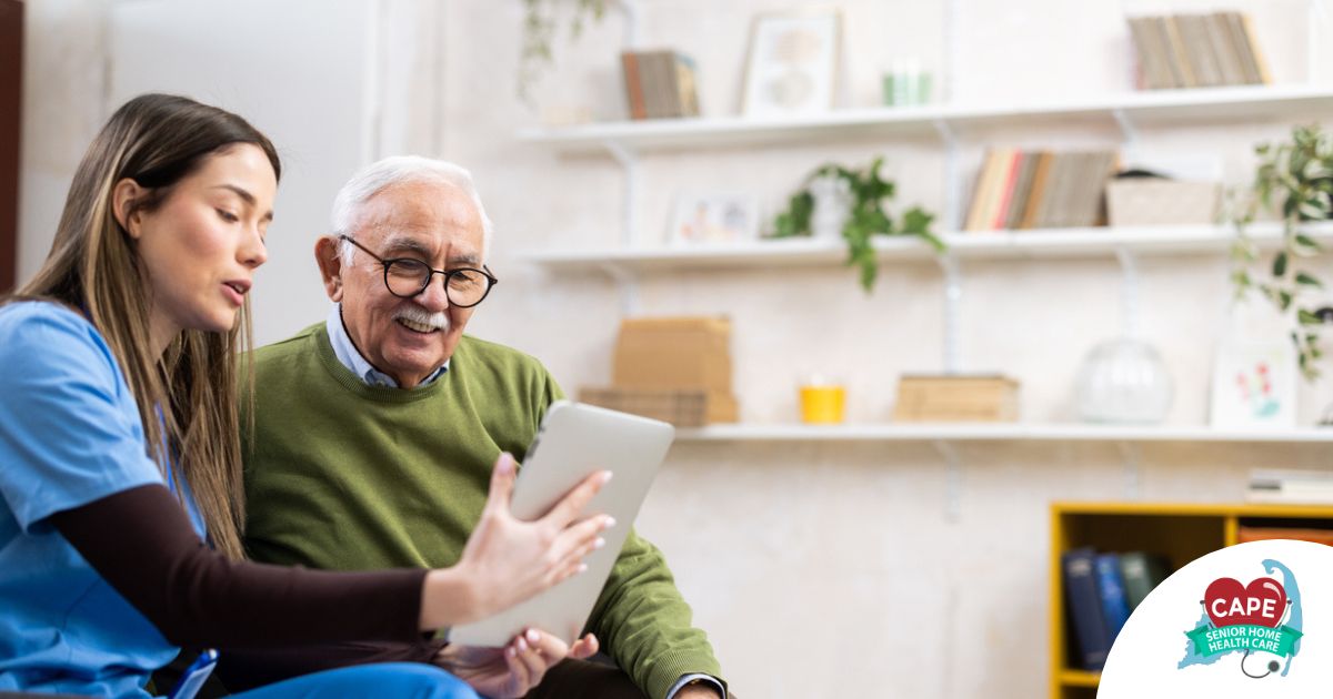 Home caregiver assisting senior man to use telehealth and senior care