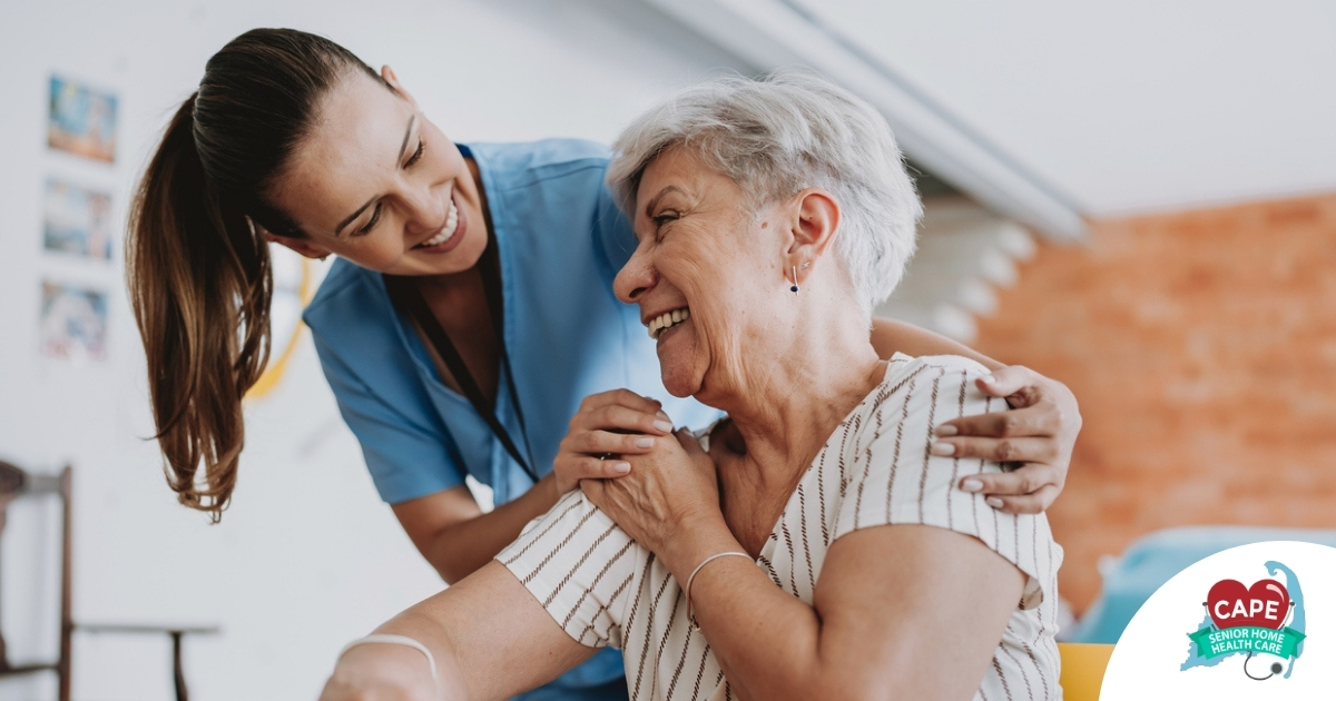 A female caregiver helping an older woman with stroke recovery at home.